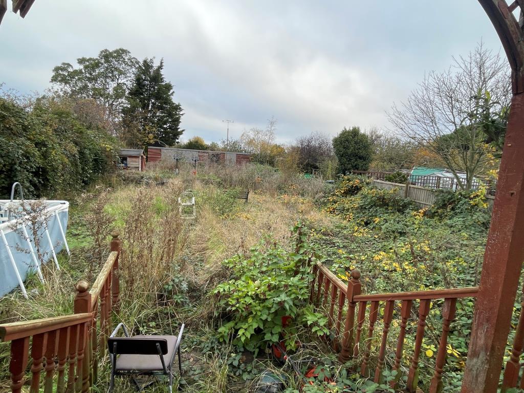 Lot: 108 - DETACHED BUNGALOW FOR REBURBISHMENT - Garden with decking and outbuilding to rear